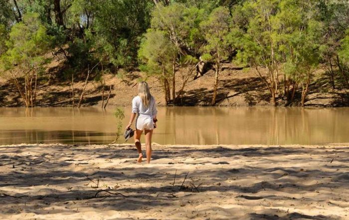 girl walking on wyandra beach